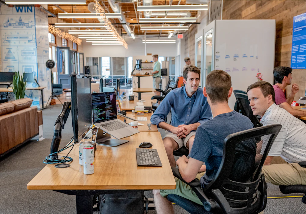 Team discussing a project plan in a meeting room