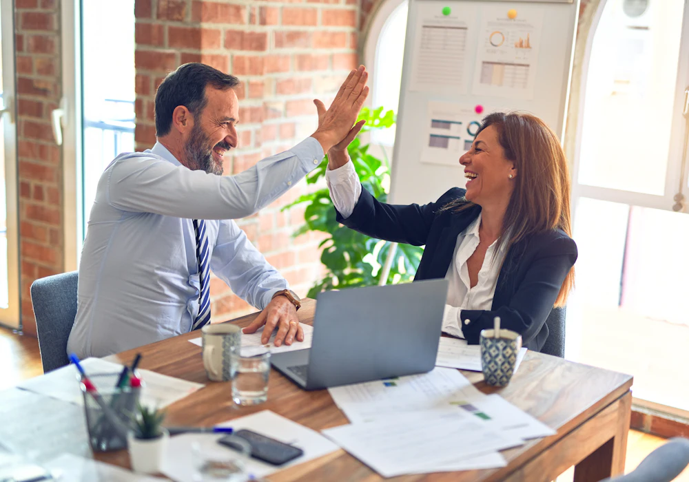 Professionals smiling while working together